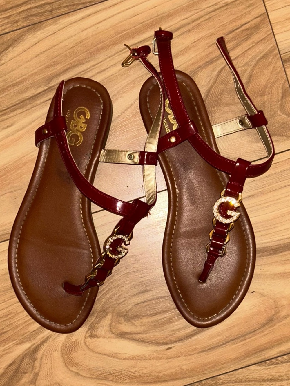 GBG Los Angeles Burgundy Patent T-Strap Sandals with Gold Logo